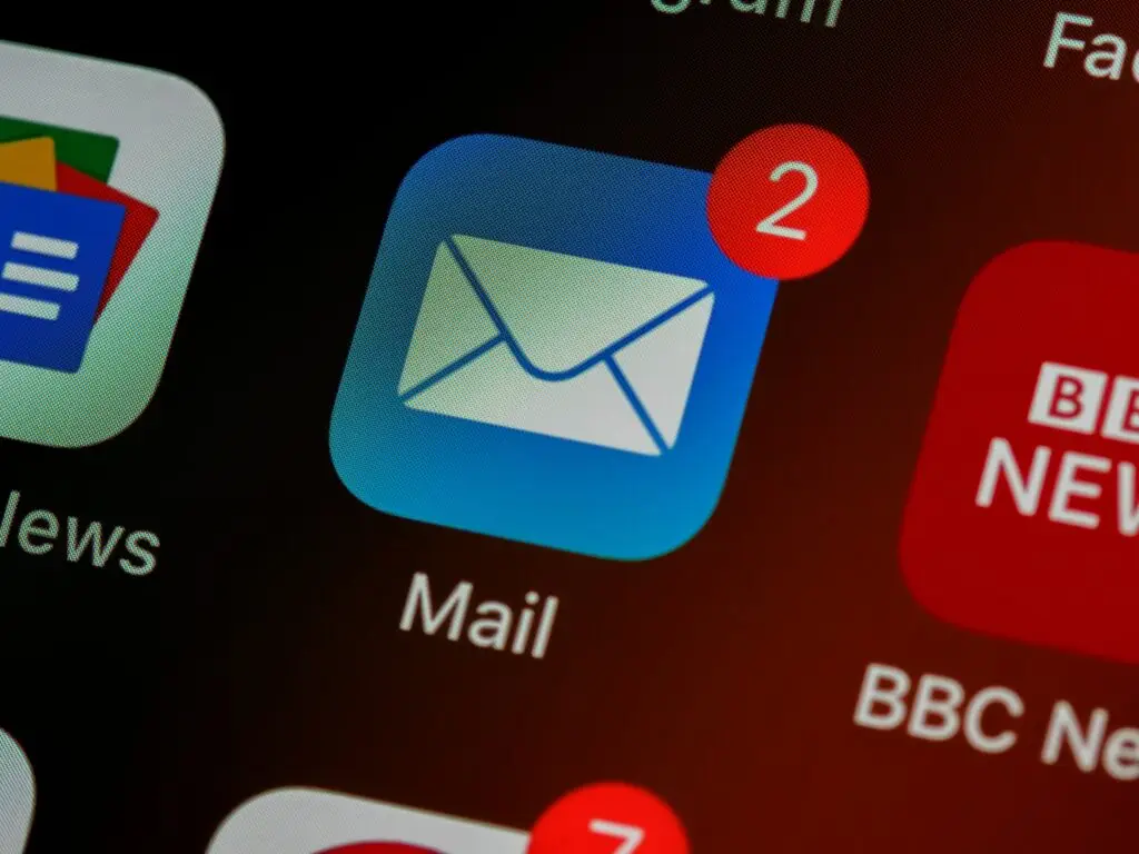 Image of apps on a screen, email symbol in the centre